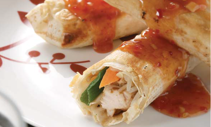 Three-chicken-and-vegetable-rolls-wrapped-in-Mountain-Bread-covered-in-sweet-chilli-sauce