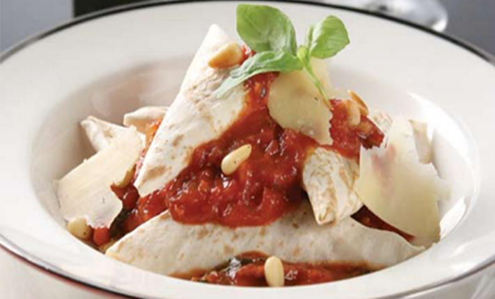 Mountain-bread-ravioli-with-roast-pine-nuts-tossed-in-a-tomato-sauce