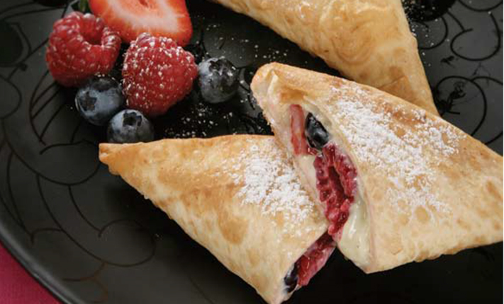 Mountain-Bread-Raspberry-and-blueberry-triangles-with-creamed-cheese-dusted-with-sugar.